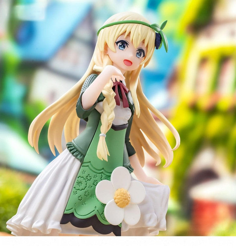 Anime figure of a blonde girl in a green and white peasant dress with a flower accent