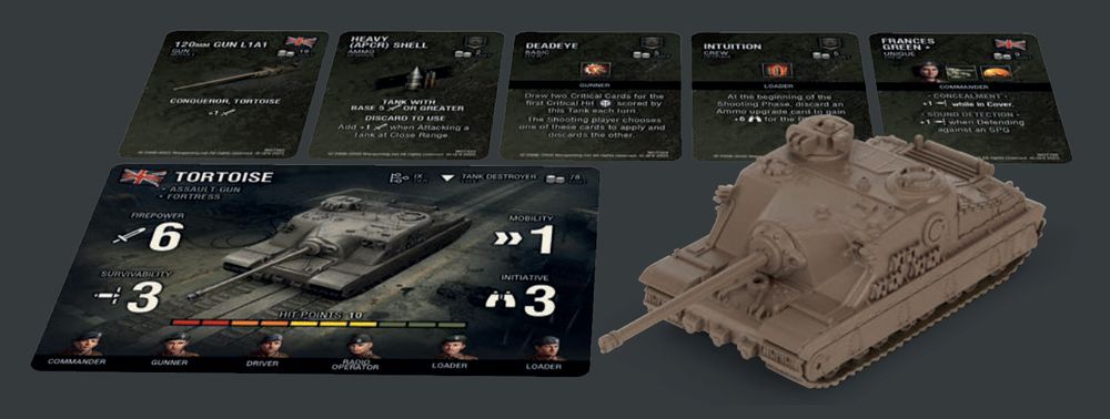 A tan Tortoise tank miniature with game cards showing stats, weapons, and crew for a tabletop wargame.