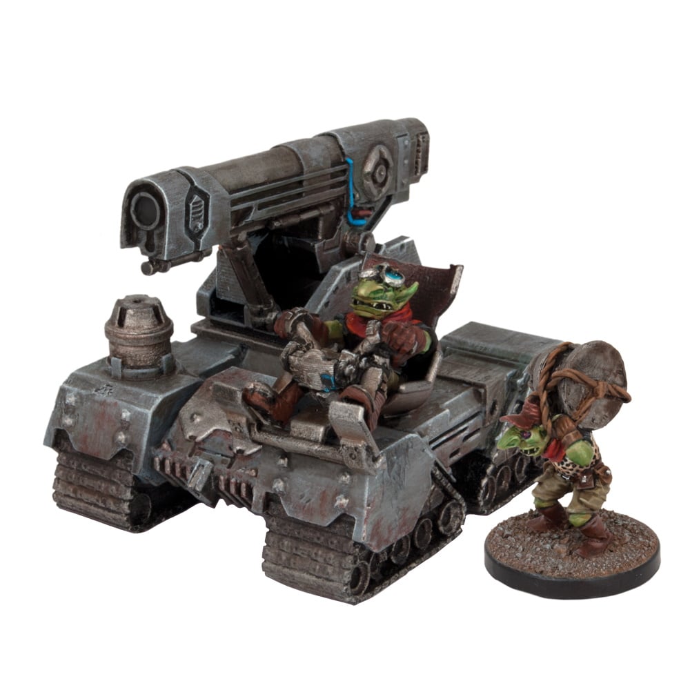 A miniature of two green goblins with a crude, tracked artillery vehicle, One drives, the other stands by