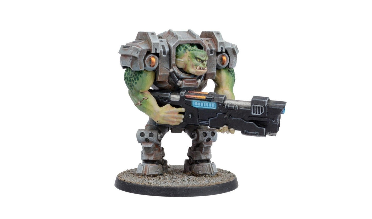 A detailed miniature of a green-skinned, orc-like creature in heavy grey power armor holding a large futuristic rifle