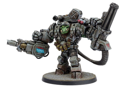A formidable green-skinned Ork miniature in gray power armor, wielding a massive cannon, gatling gun, and shoulder missiles