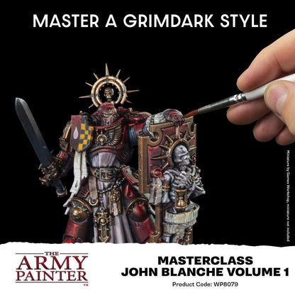 Close-up of a hand painting a heavily armored, red and gold miniature in the grimdark style