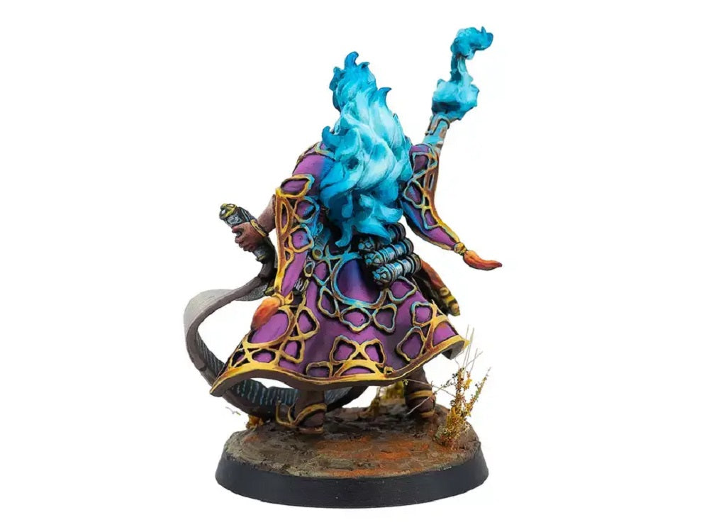 Painted miniature of a sorcerer in purple robes, viewed from behind, with blue flaming hair and a flaming staff