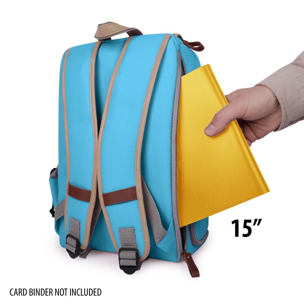 Hand inserting a 15-inch yellow binder into a blue backpack, demonstrating storage capacity.