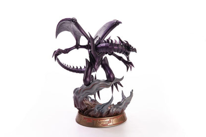 Side view of detailed collectible statue of a metallic violet winged dragon with an open mouth, standing on a fiery base