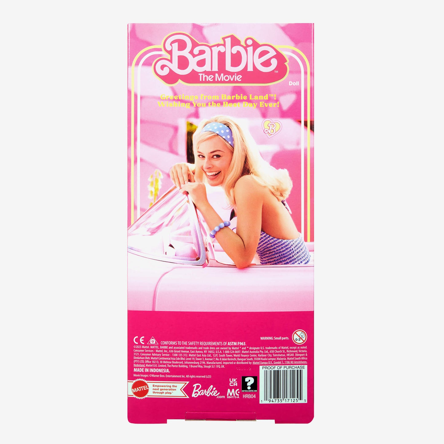 Barbie The Movie doll packaging features Margot Robbie as Barbie smiling and leaning on a pink car