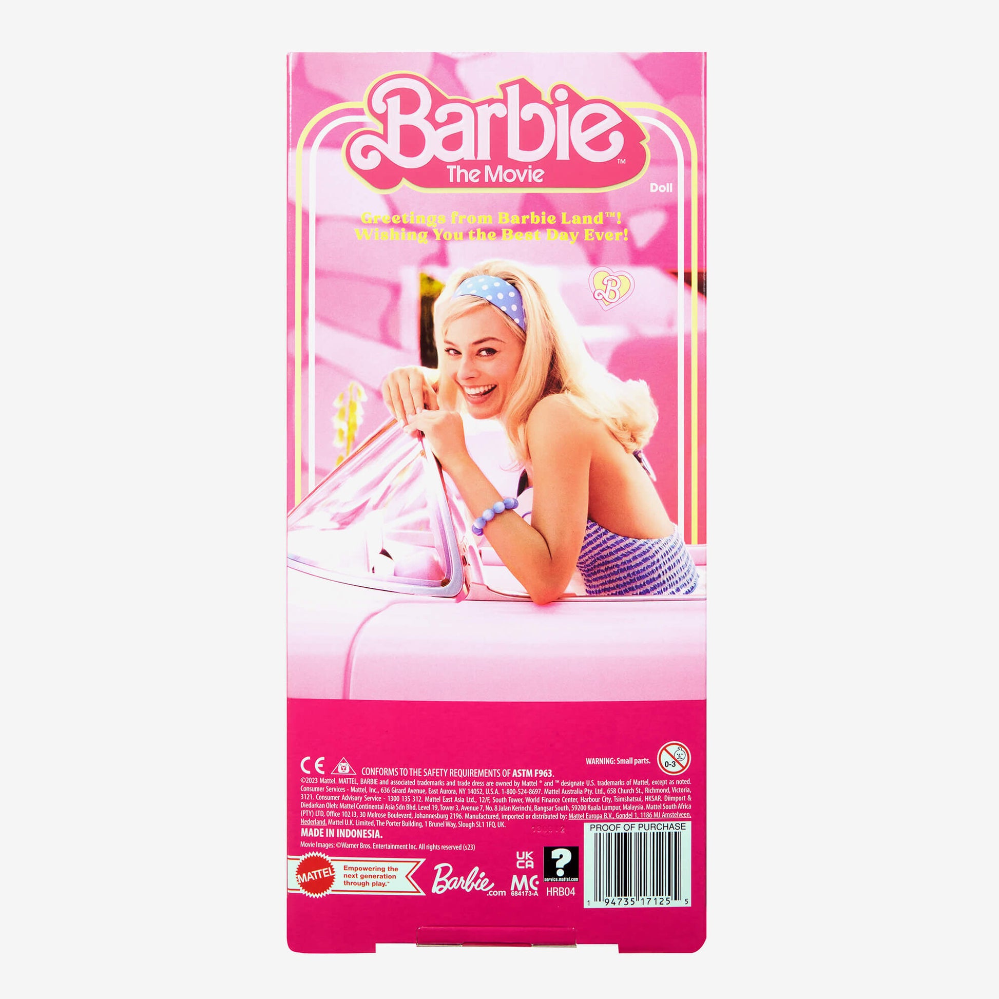 Barbie The Movie doll packaging features Margot Robbie as Barbie smiling and leaning on a pink car