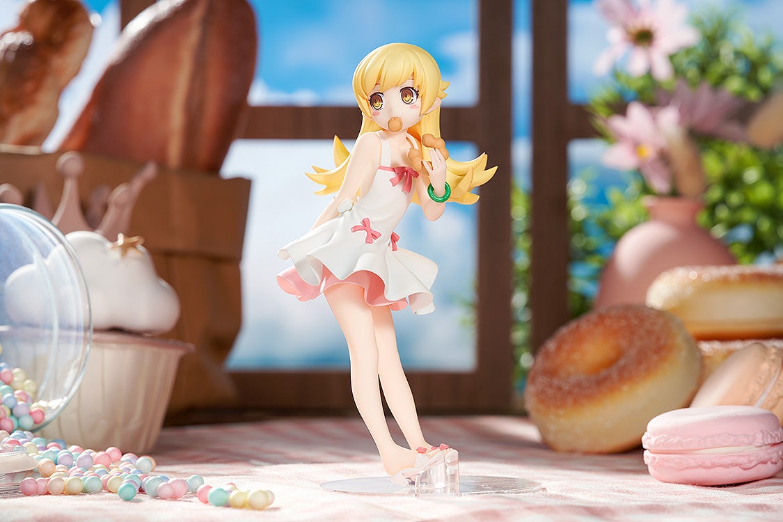 Blonde anime girl figure in a white dress eating donuts. Pastries, candy, and flowers fill the bright, sweet scene