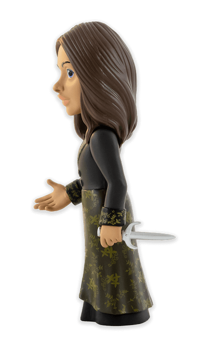 Side view of Minix The Witcher Yennefer vinyl figure depicting Yennefer in a dark green dress with gold leaf patterns and holding a silver dagger