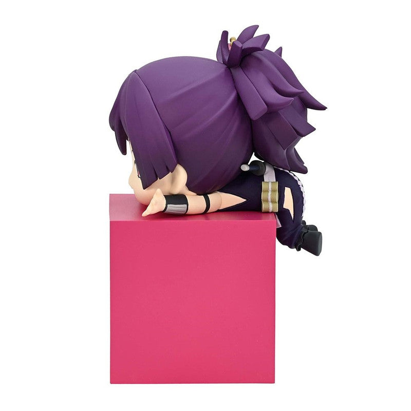 Purple-haired chibi anime figure in black and gold sitting on a pink block