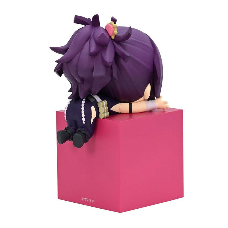 Purple anime figure sitting on a bright pink cube with gold floral hair accessory