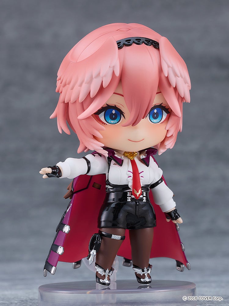 Cute chibi anime figure with pink hair blue eyes a white and black outfit and a red cape